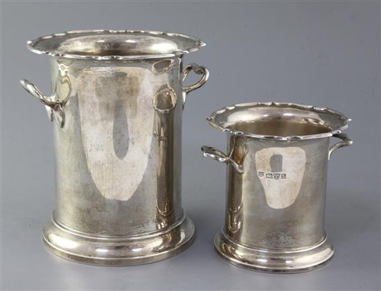 Two graduated George V two handled silver syphon stands by Barker Brothers, 38 oz.